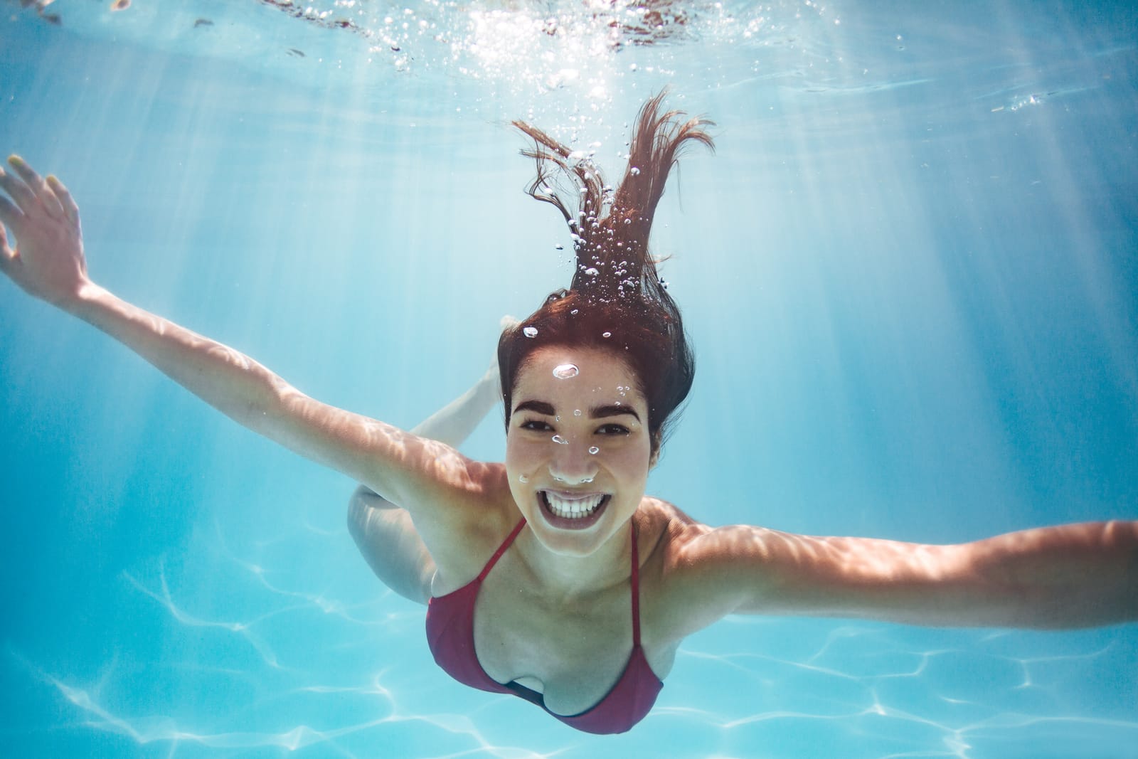 Woman Swimming Underwater Pool