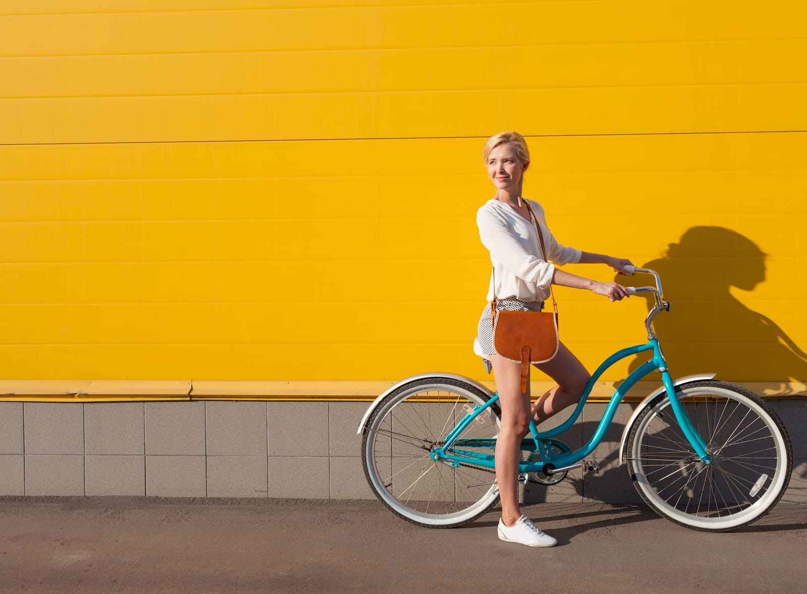 Woman Teal Bike Yellow Wall