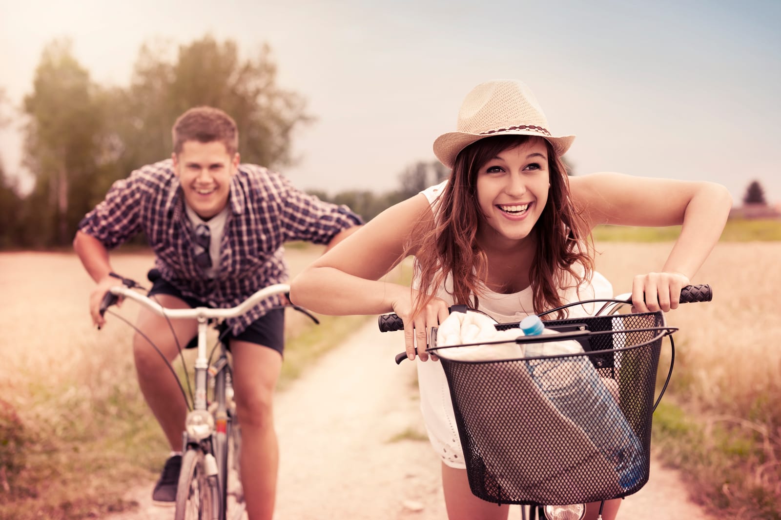 Young Couple Biking Country Road