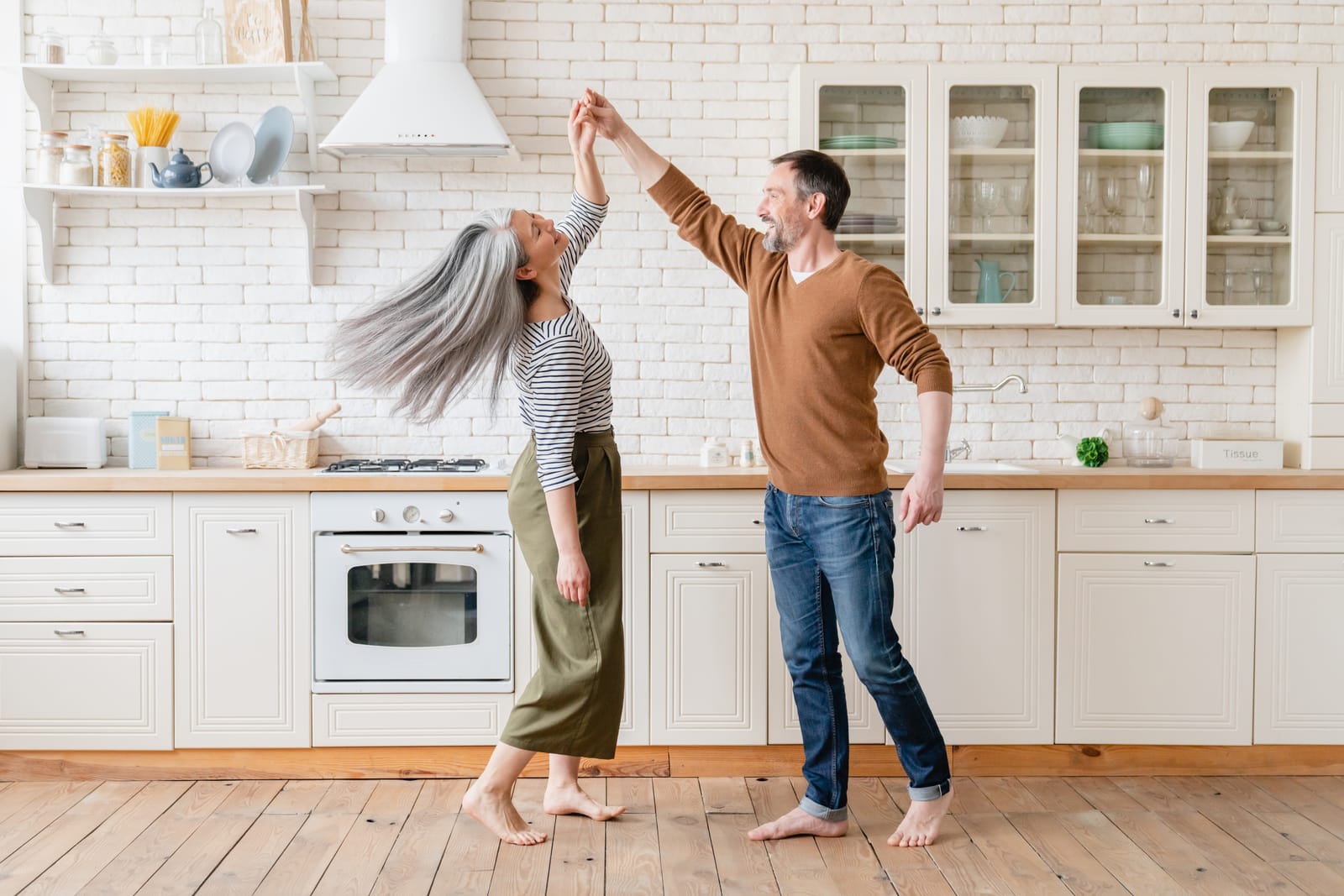 Couple Dancing Twirl White Kitchen