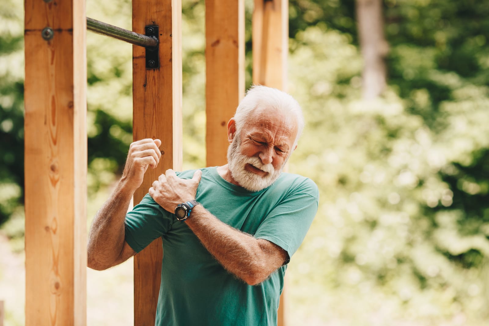 Older Man Shoulder Pain Outdoors