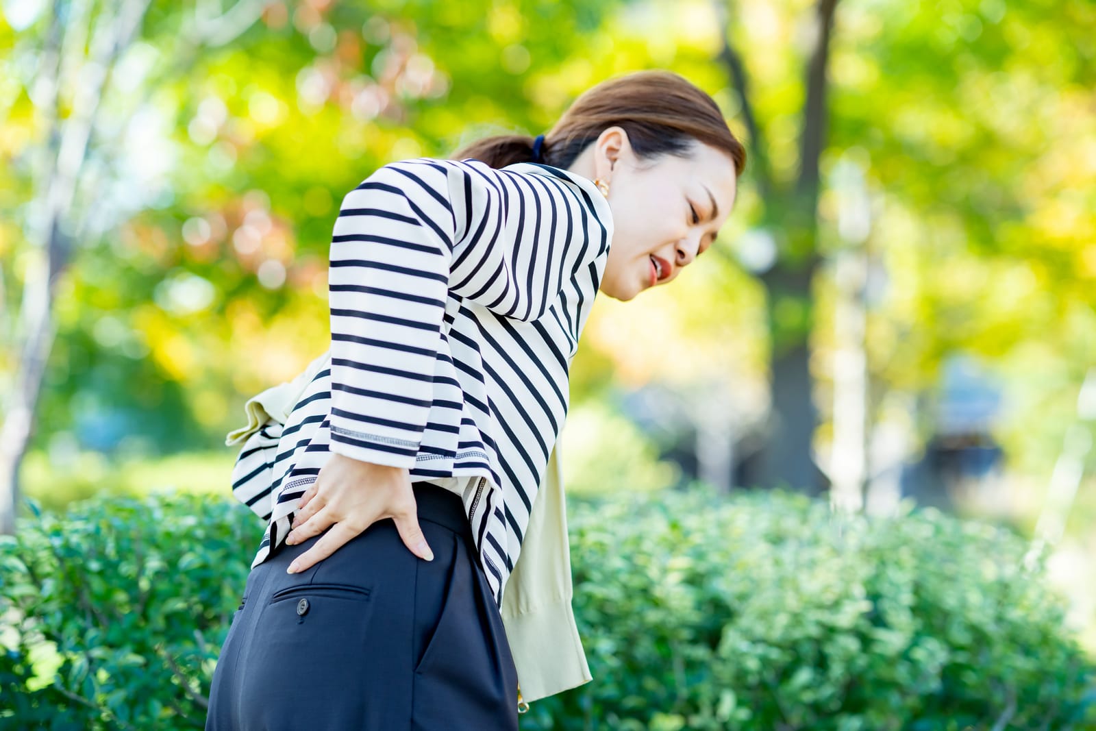 Woman Back Pain Park Outdoors
