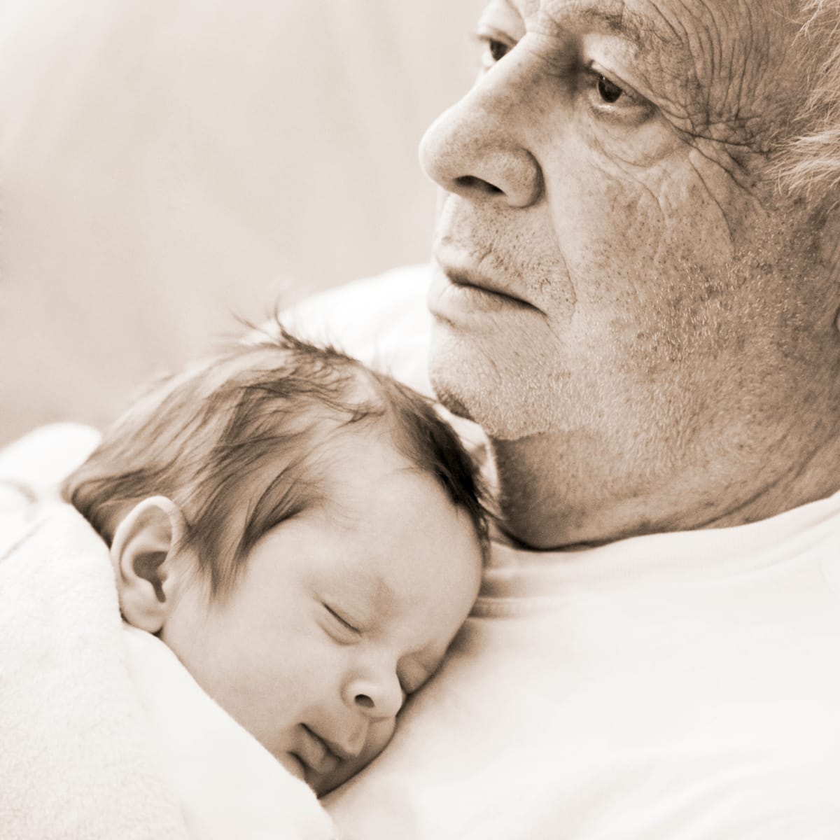 Grandpa Holding Sleeping Baby