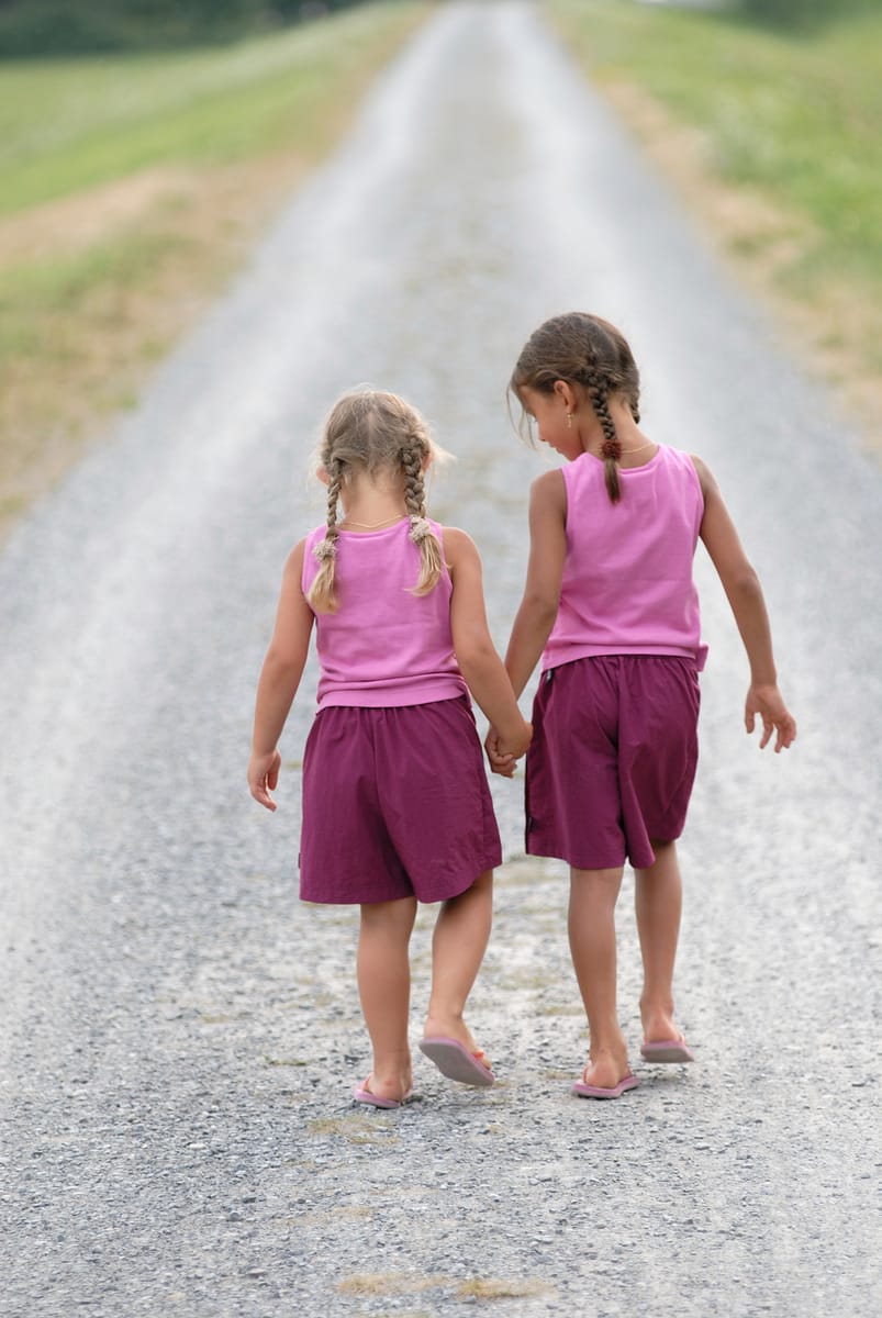 Two Girls Walking Country Road