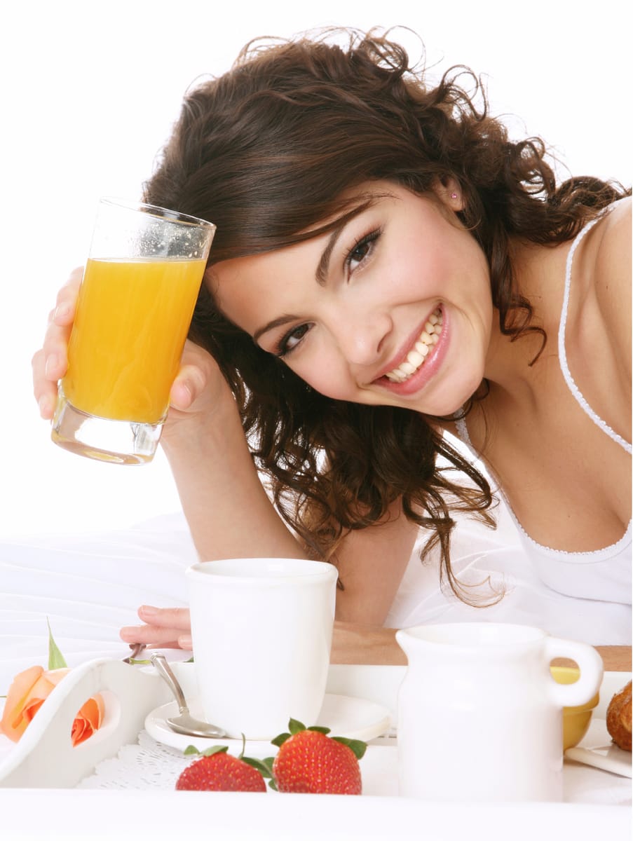 Woman Holding Orange Juice