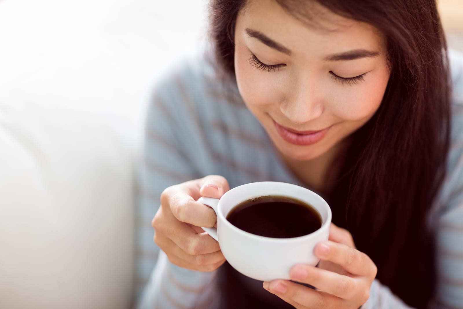 Woman Enjoying Cup Of Tea